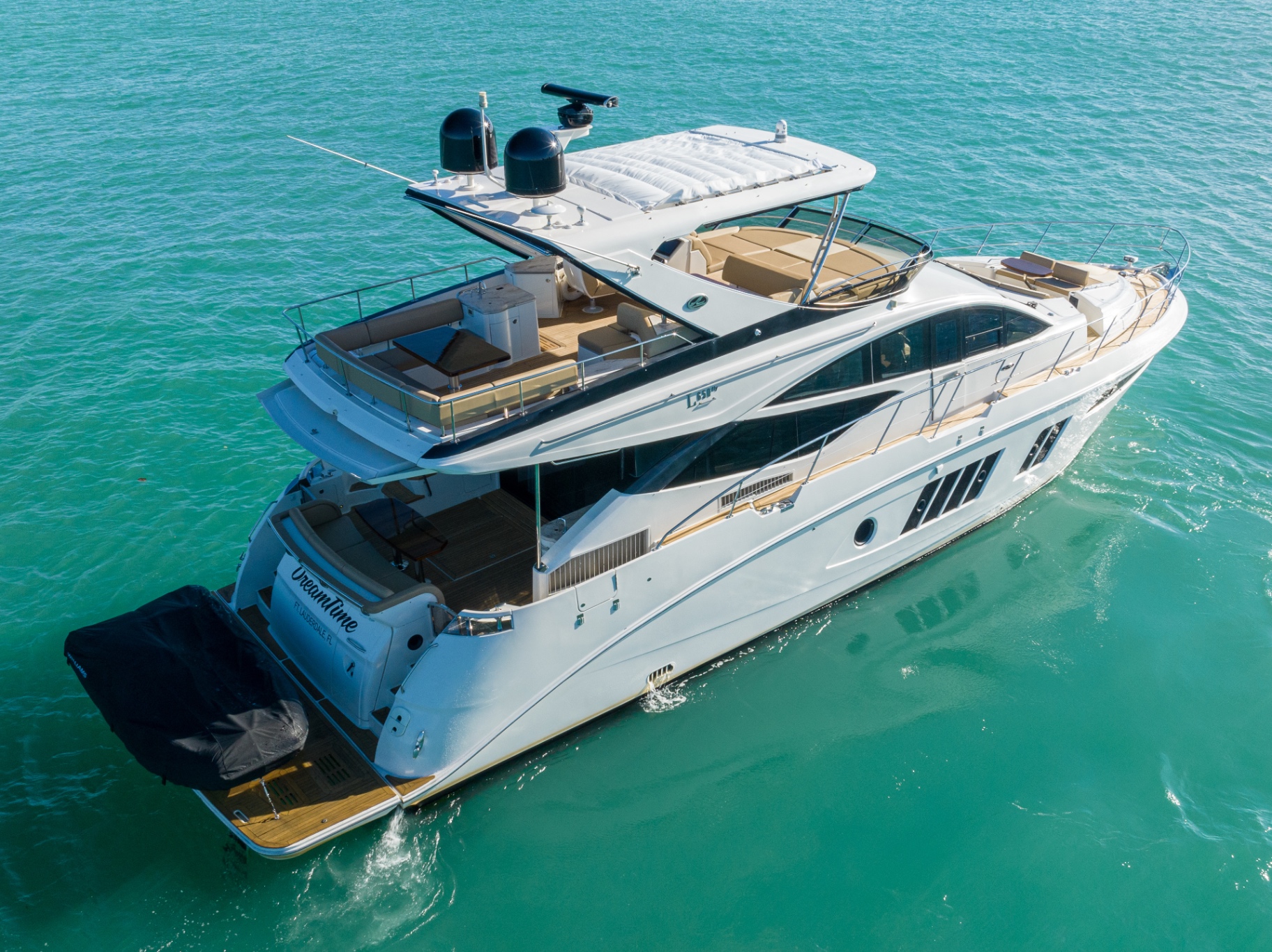 Aerial view of M/Y DreamTime over turquoise water