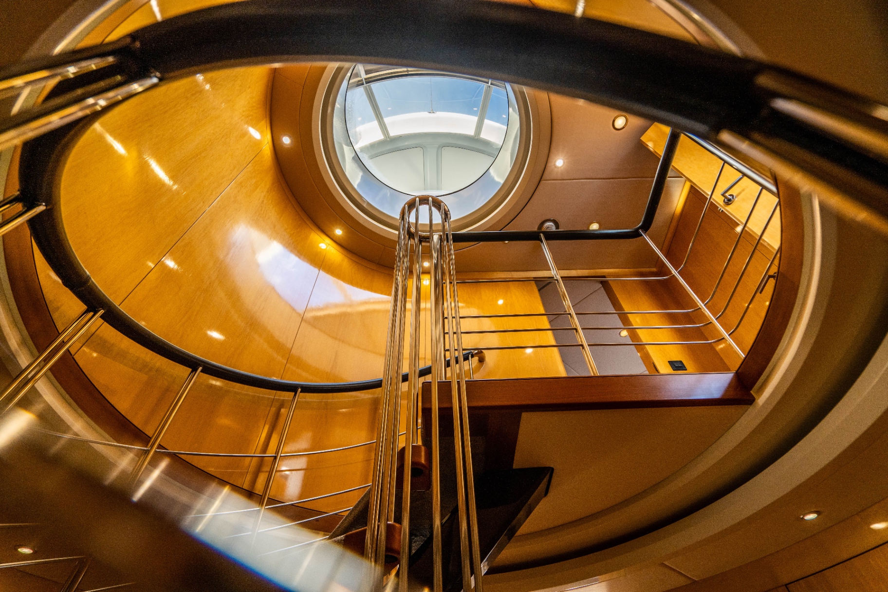 Spiral staircase looking up to the skylight